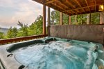 Terrace level hot tub and swing overlooking mountain view 